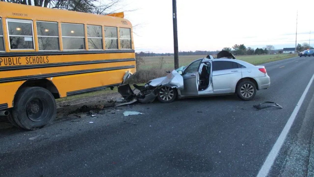 A Car Collides With A School Bus In Pleasantville