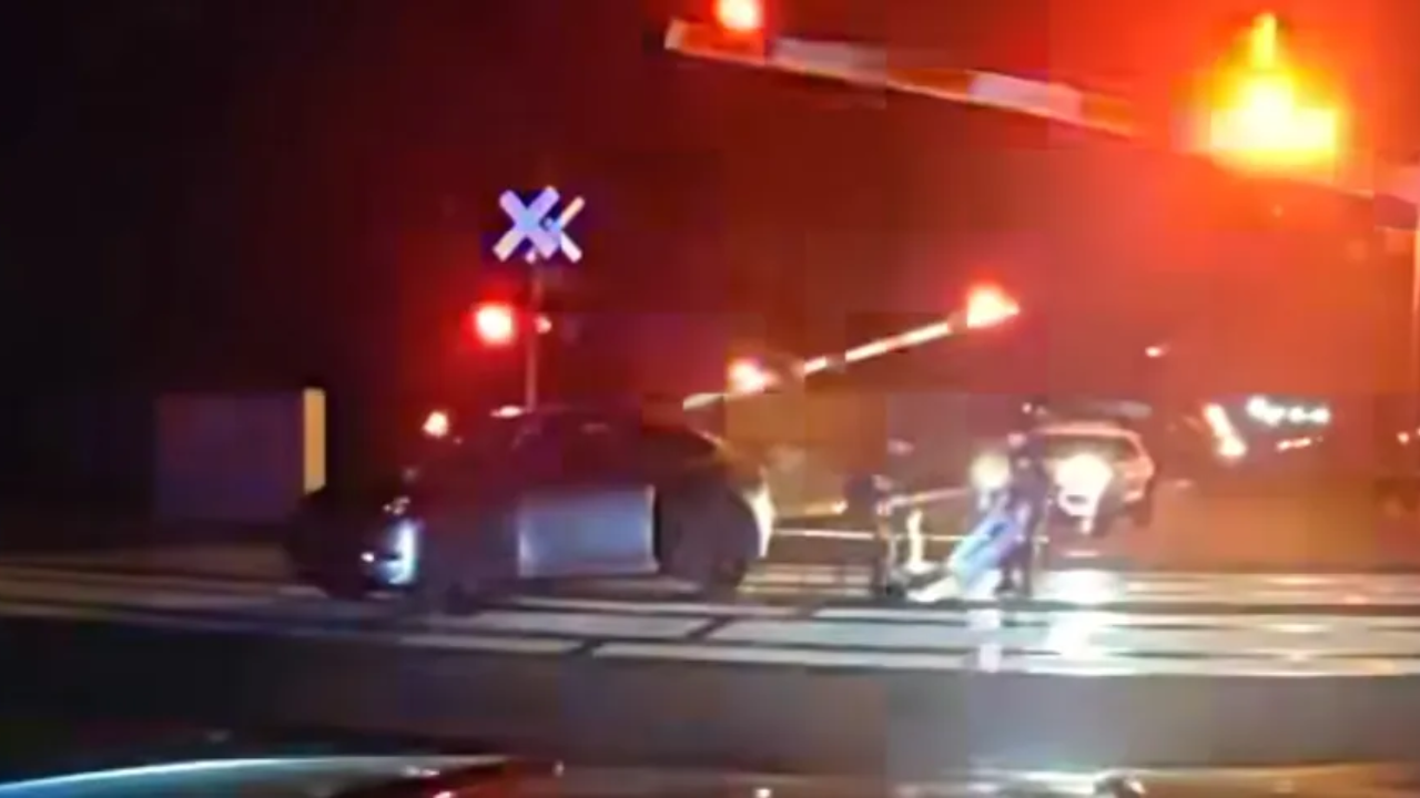 NJ Officers Pull Man To Safety Moments Before Train Crashes Into His Car